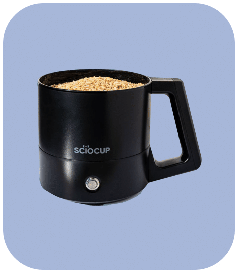 Black smart cup containing grains against a light blue background.